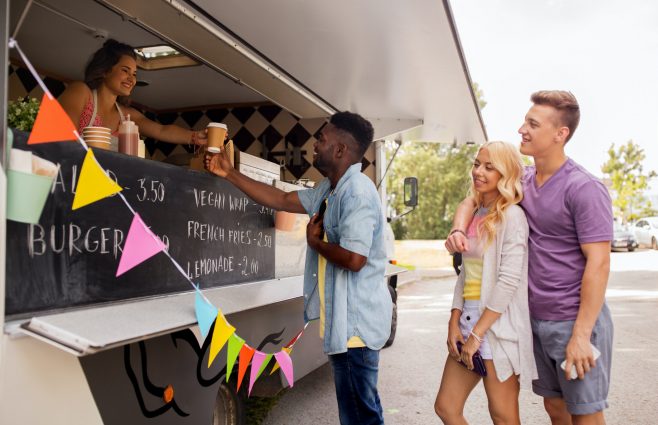 happy customers queue at food truck